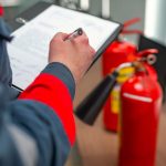 Engineer Professional are Checking A Fire Extinguisher Using Clipboard or checking Industrial fire control system,Fire Alarm controller, Fire notifier, Anti fire.System ready In the event of a fire.